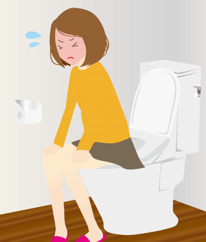 トイレで便秘に苦しむ女性