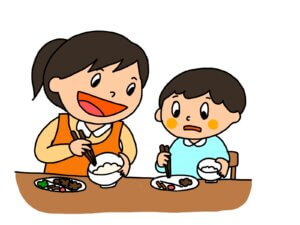 お箸の持ち方を教えるママ